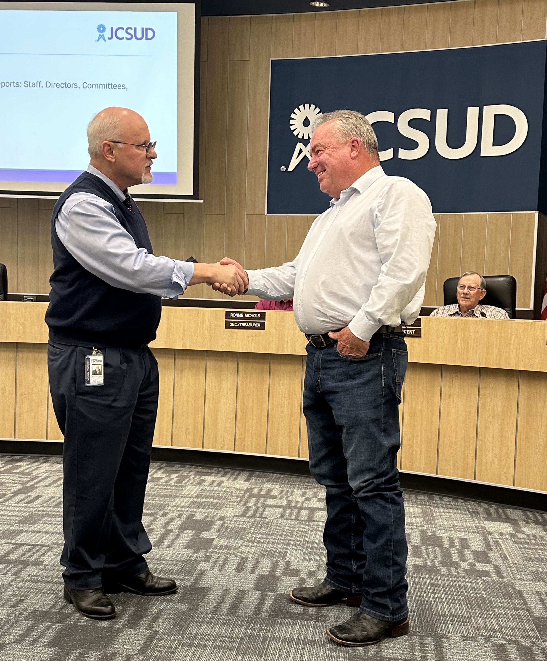 Employee receiving an award from manager