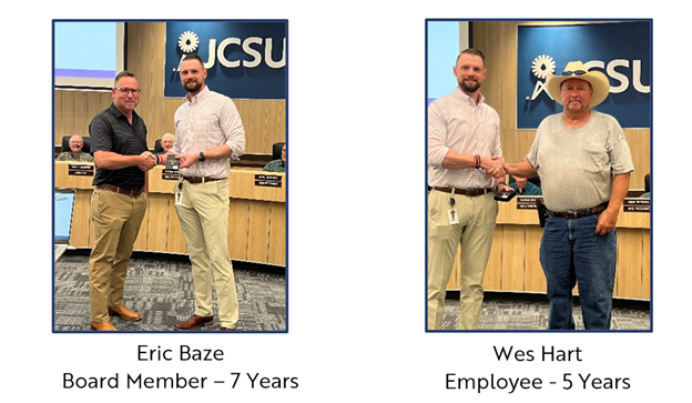 Staff members being presented with awards