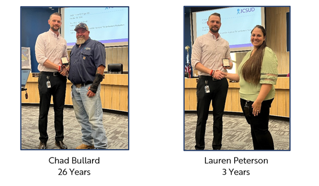 Two JCSUD employees being presented with an award from the General Manager