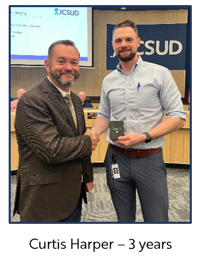 JCSUD employee receiving a service award from the General Manager