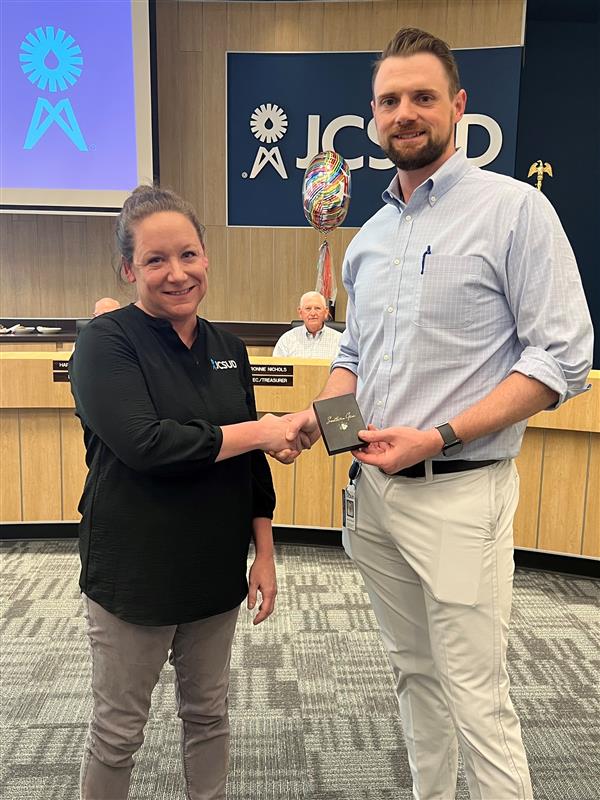 JCSUD employee receiving a service award from the General Manager