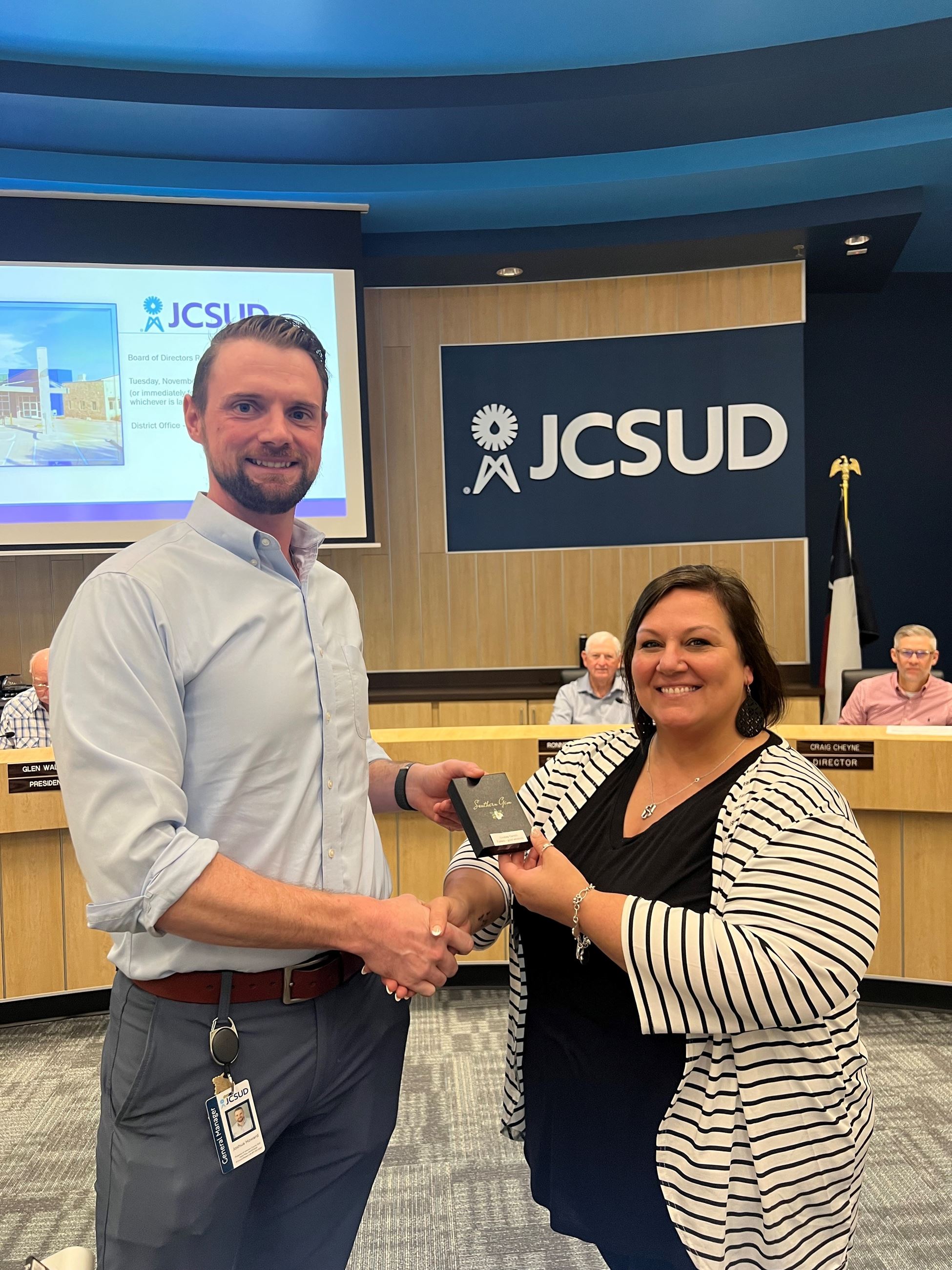 Staff member being presented with award