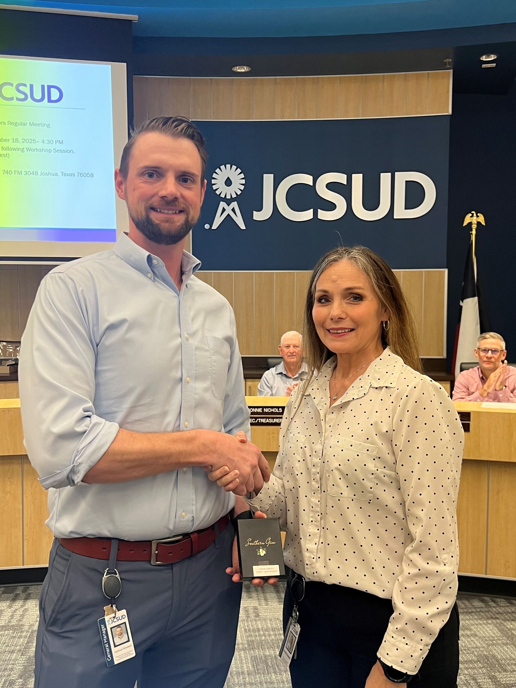 Staff member being presented with an award