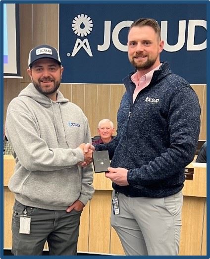 Staff member being presented with an award